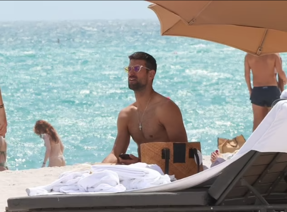 “Watch Novak Djokovic Takes Beach Break With Friends Amidst Miami Open Withdrawal”