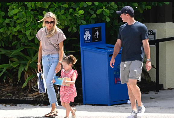 Rory McIlroy puts his wedding ring back on as he and wife Erica Stoll play happy families with daughter Poppy.
