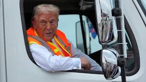 2024 election updates: Trump rides to rally in marked garbage truck